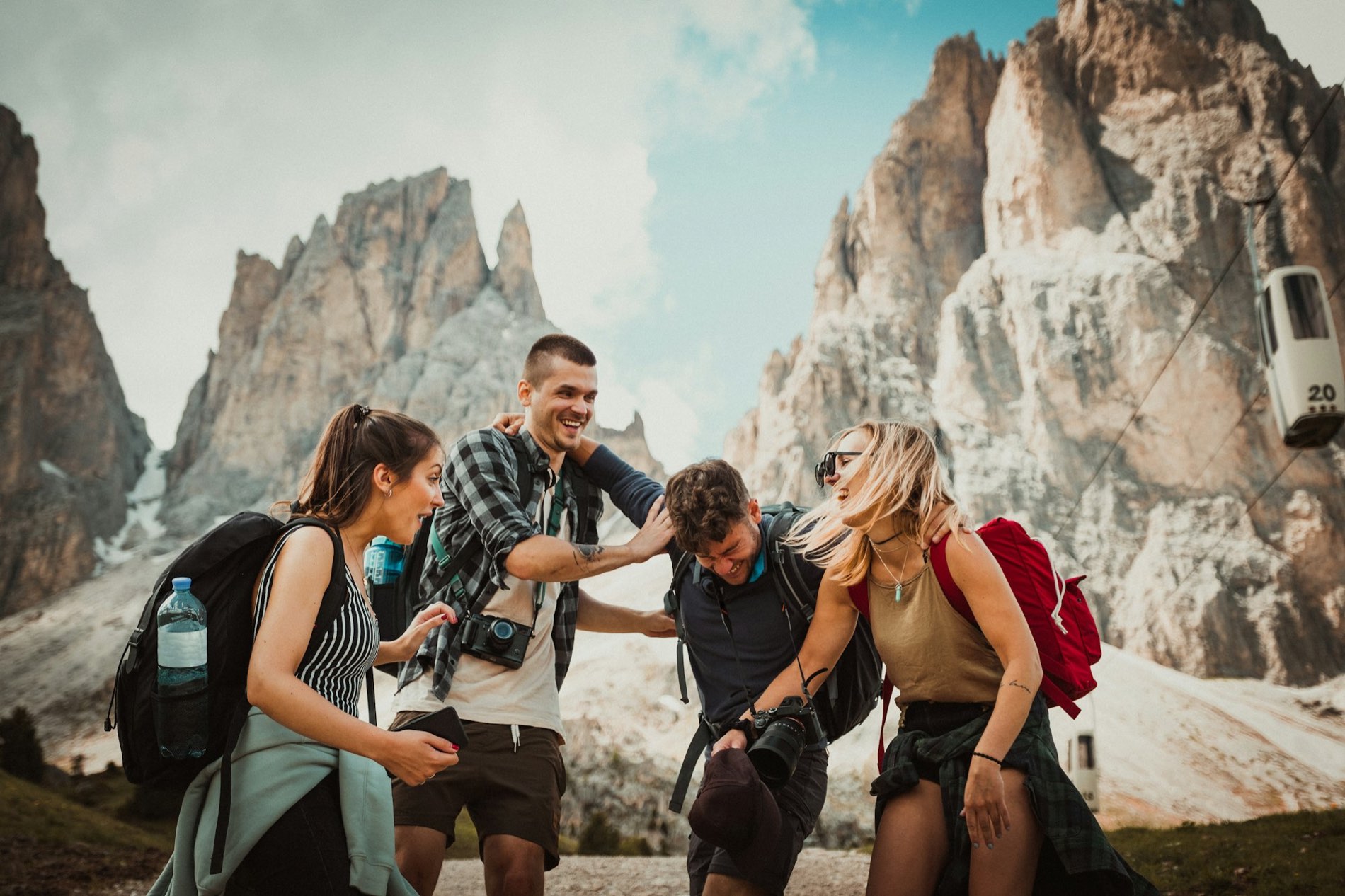 Four friends hiking together in the mountains